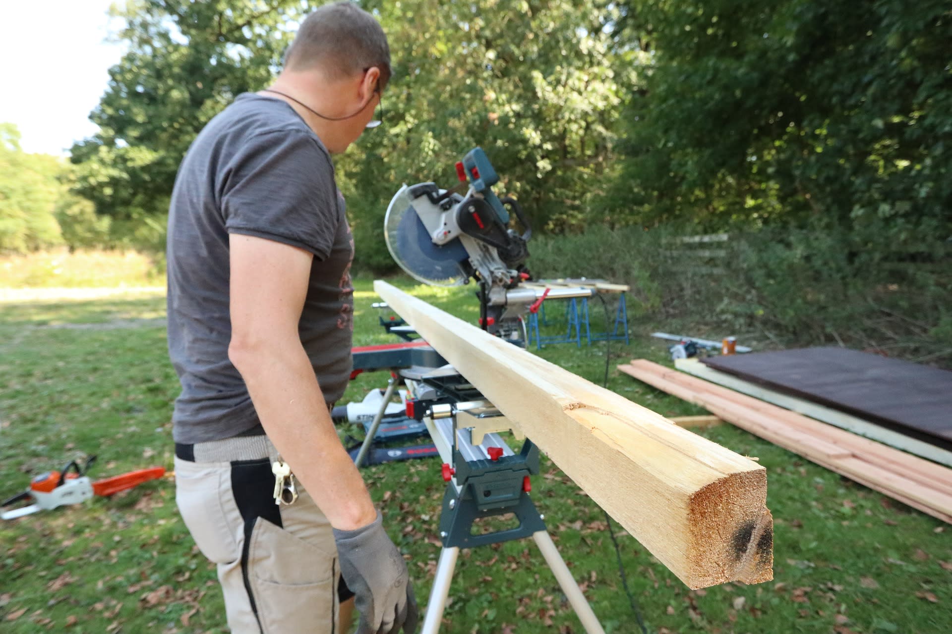 carpenter preparing to cut lumber - home renovation project niagara